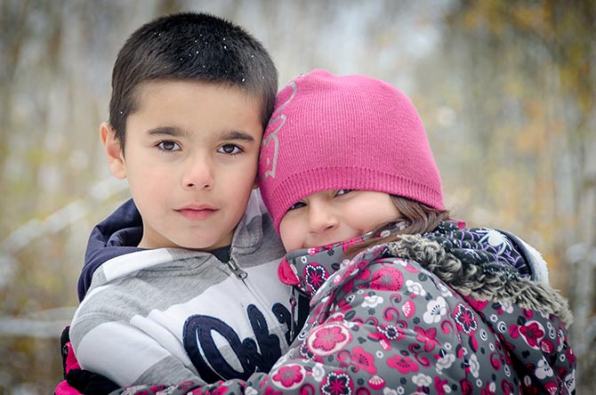 two kids hugging